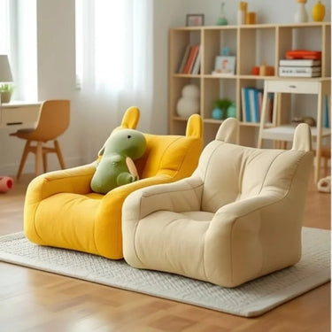 Two Cat Cartoon Sofa Beds by KittyNook Cat Co. add charm to a cozy, well-lit room with a rug and bookshelf.